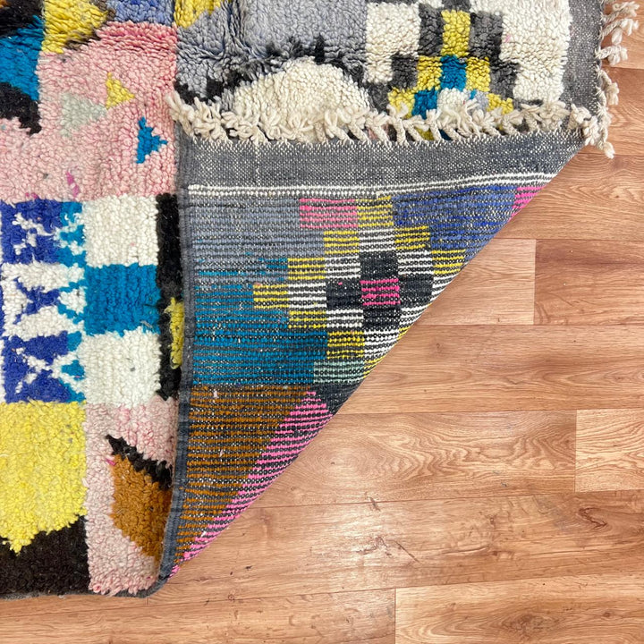 Vintage Moroccan wool rug with colorful patchwork geometric patterns in blue, pink, yellow and ivory, handwoven Berber rug 248x156 cm
