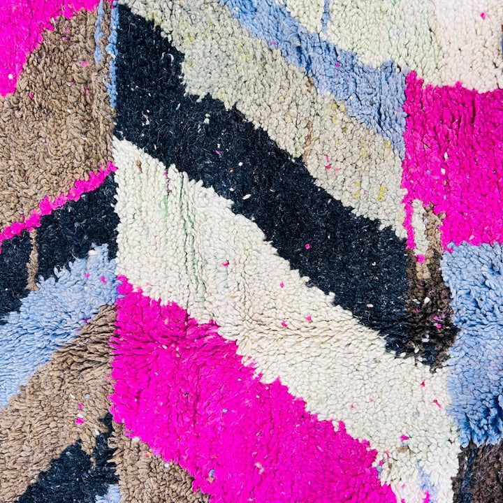 Vintage Moroccan wool rug with abstract Berber geometric pattern in pink, ivory, blue, and black