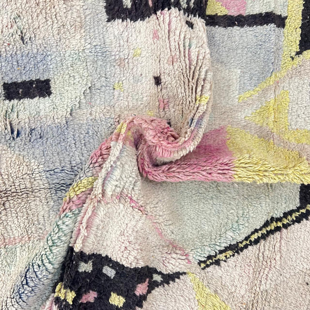Vintage Moroccan wool rug with minimal abstract Berber patterns in ivory, blush and soft yellow, handmade in Morocco.