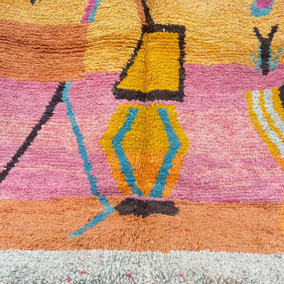 Vintage Moroccan wool rug with abstract Berber tribal symbols in mustard, terracotta and blush pink, handmade in Morocco.
