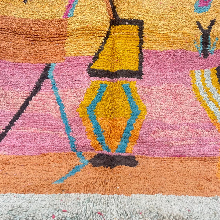 Vintage Moroccan wool rug with abstract Berber tribal symbols in mustard, terracotta and blush pink, handmade in Morocco.