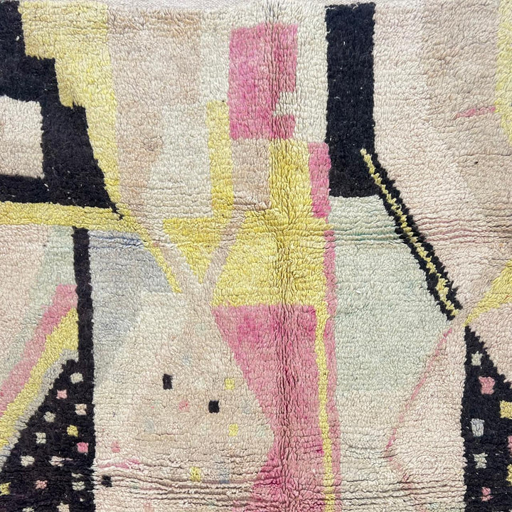 Vintage Moroccan wool rug with minimal abstract Berber patterns in ivory, blush and soft yellow, handmade in Morocco.