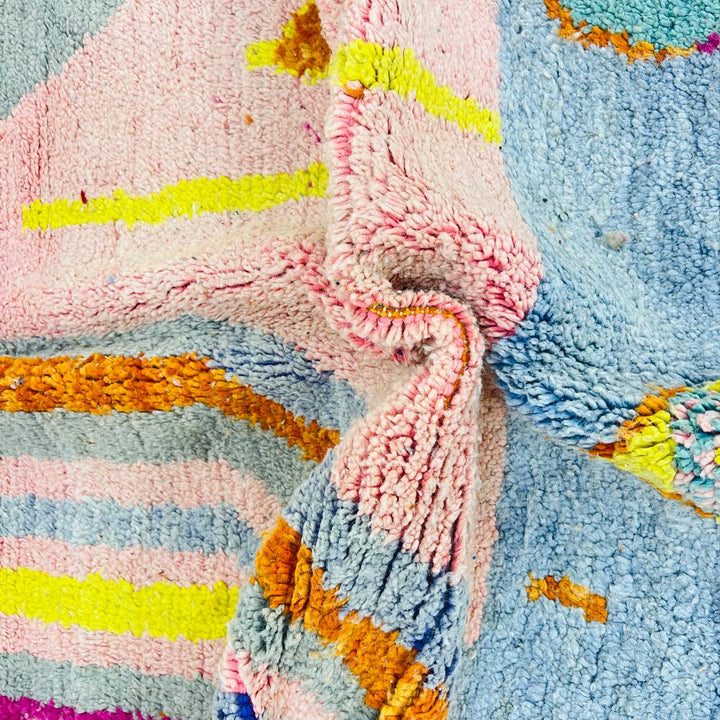 Vintage Moroccan wool rug with blush pink base and abstract Berber line patterns