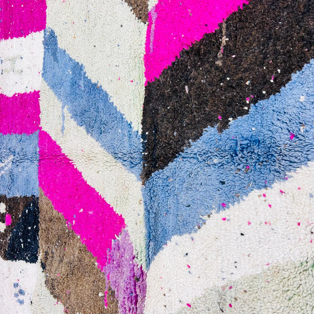 Vintage Moroccan wool rug with abstract Berber geometric pattern in pink, ivory, blue, and black