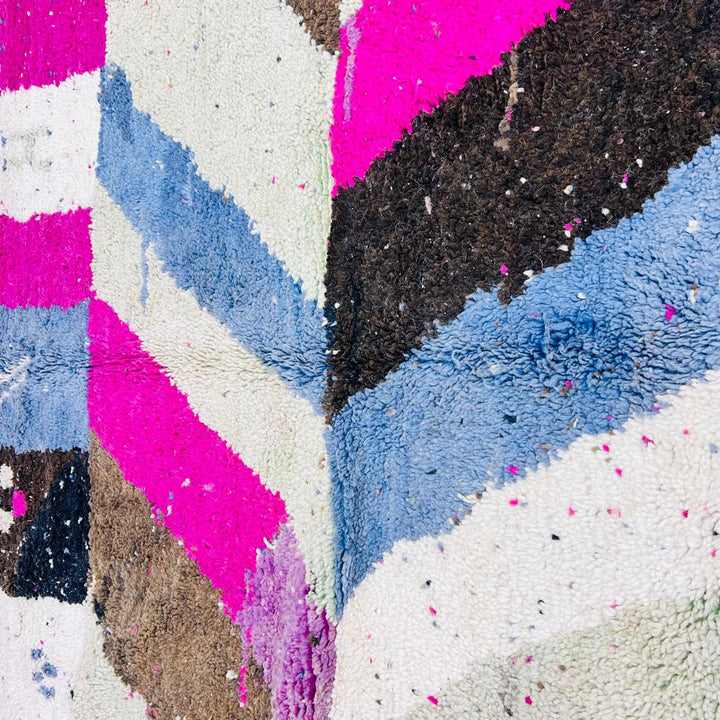 Vintage Moroccan wool rug with abstract Berber geometric pattern in pink, ivory, blue, and black