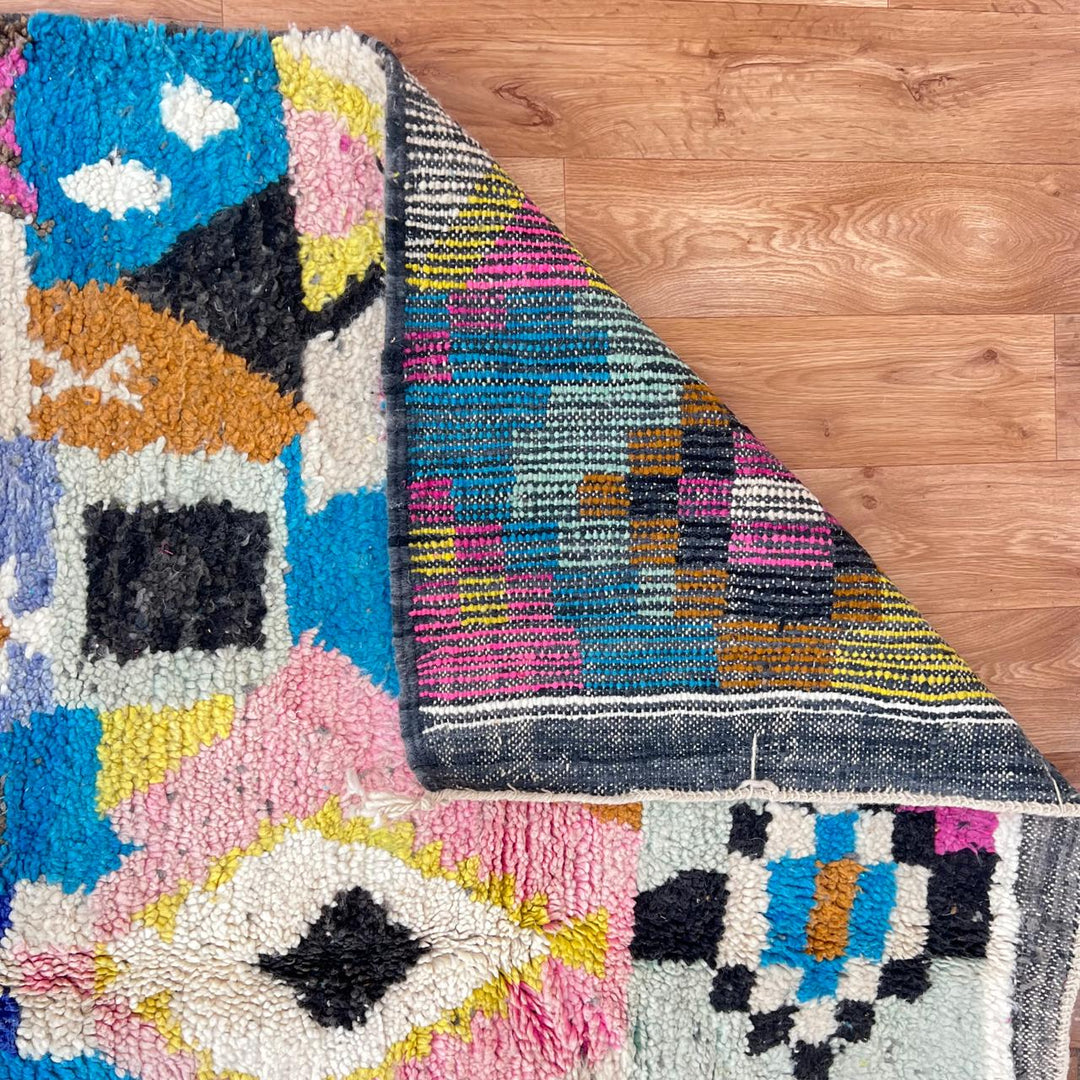 Vintage Moroccan wool rug with colorful patchwork geometric patterns in blue, pink, yellow and ivory, handwoven Berber rug 248x156 cm