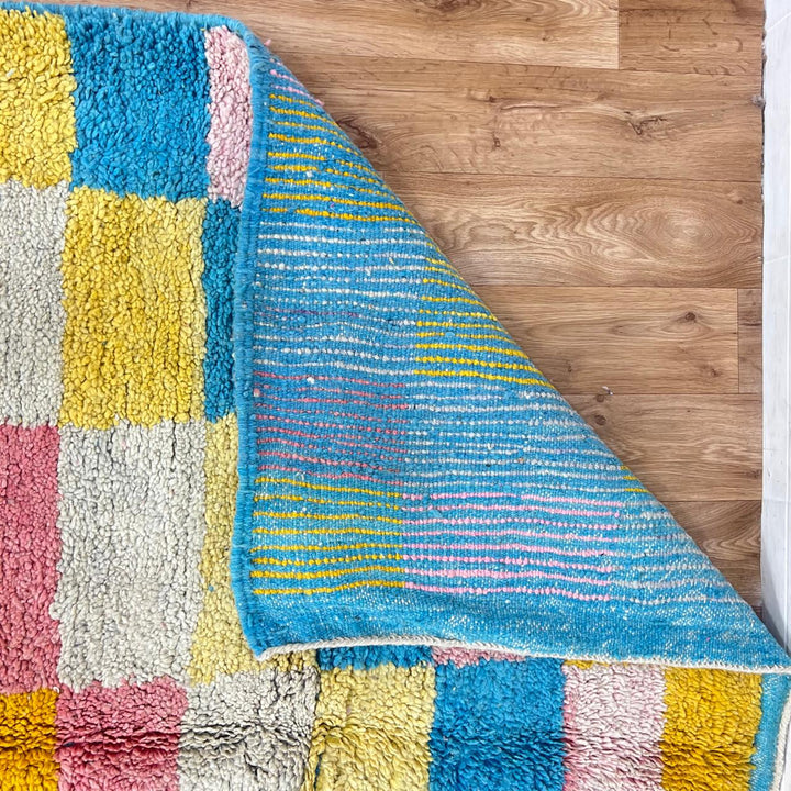 Vintage Moroccan wool rug with colorful checkered pattern in mustard yellow, blush pink, sky blue and ivory