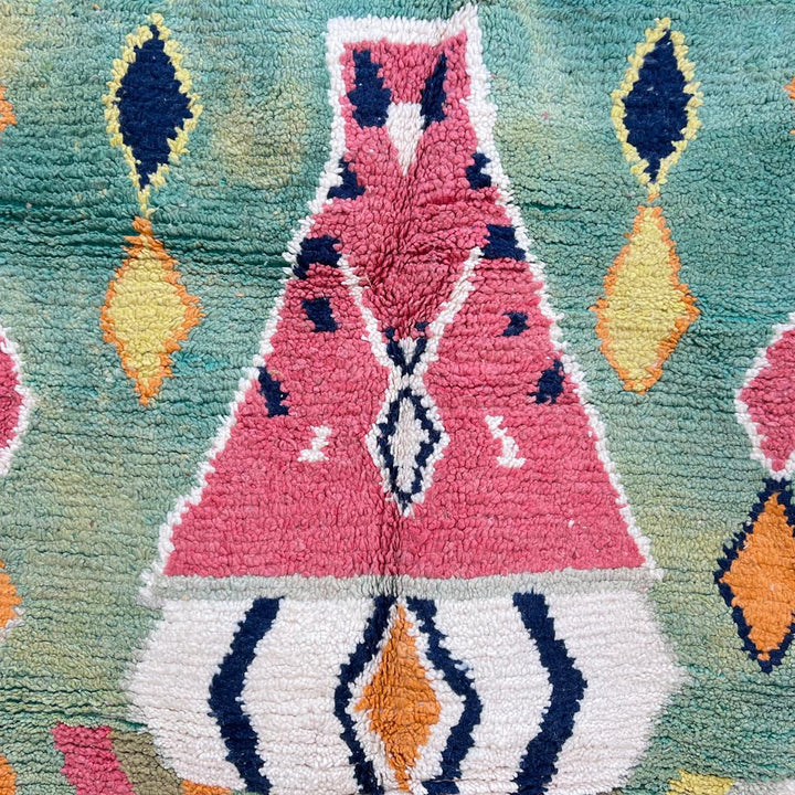 Vintage green Moroccan Berber rug with zigzag stripes and central diamond motif, handmade wool tribal area rug