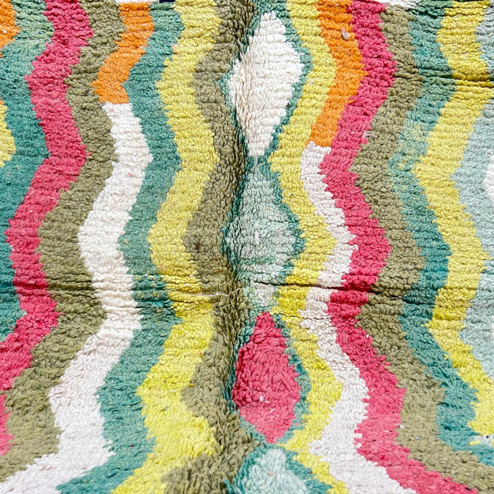 Vintage green Moroccan Berber rug with zigzag stripes and central diamond motif, handmade wool tribal area rug