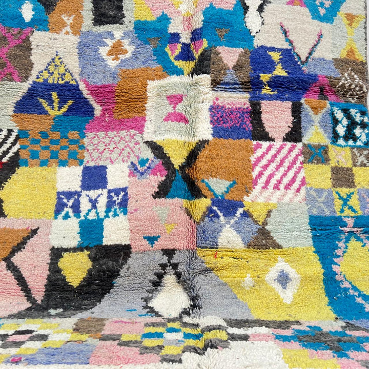 Vintage Moroccan wool rug with colorful patchwork geometric patterns in blue, pink, yellow and ivory, handwoven Berber rug 248x156 cm