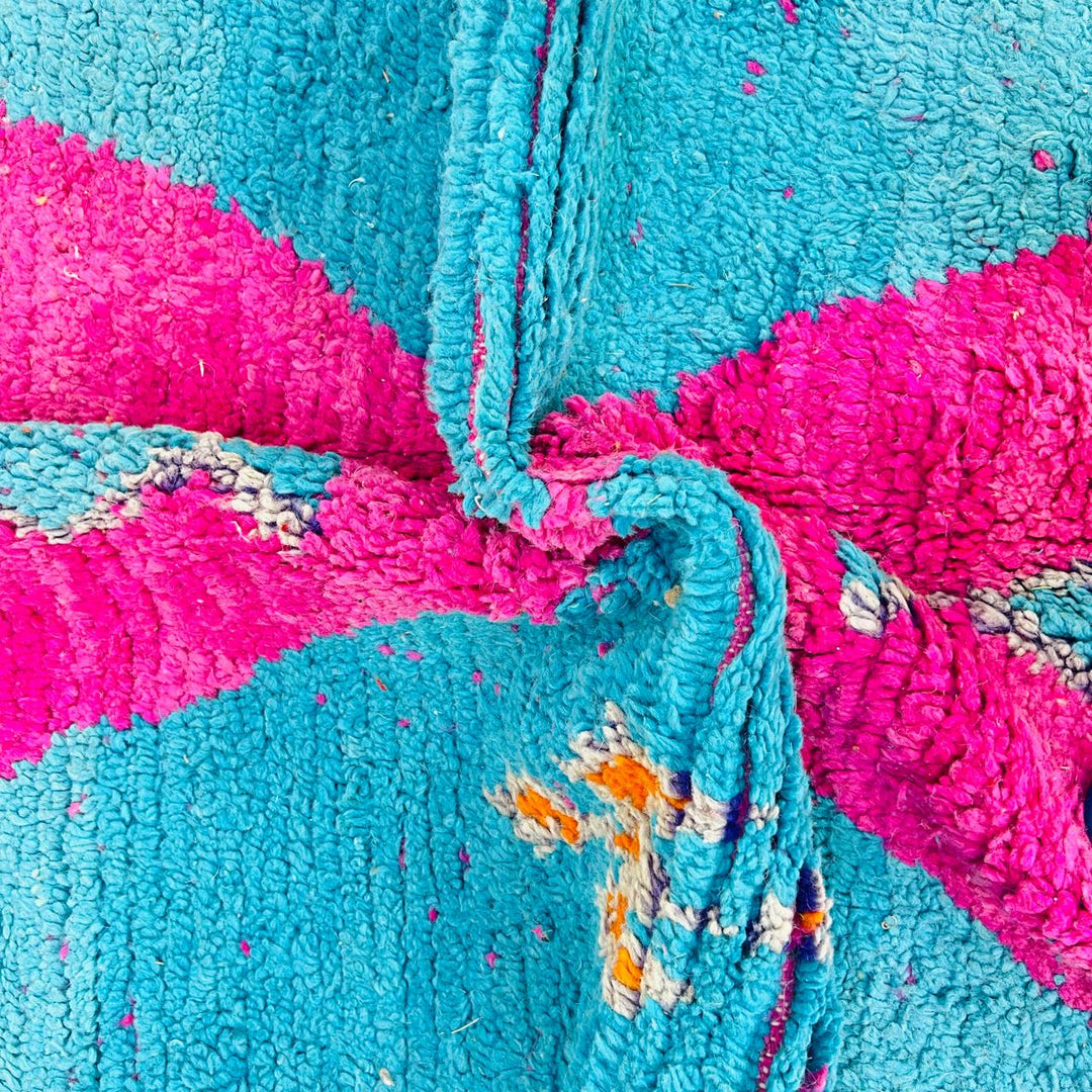 Vintage Moroccan rug with pink and teal geometric Berber design handmade from natural wool