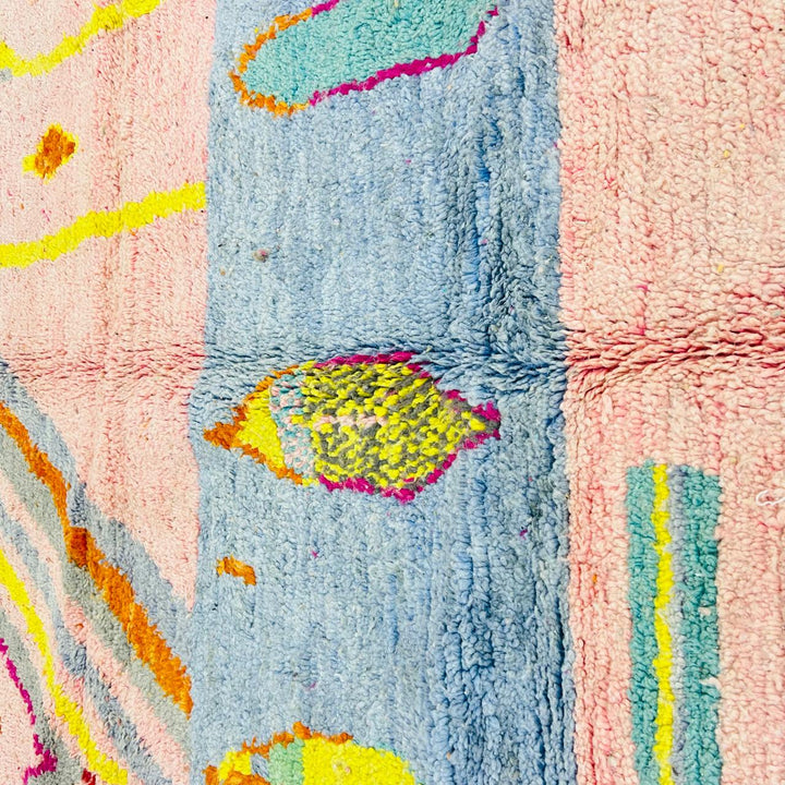 Vintage Moroccan wool rug with blush pink base and abstract Berber line patterns