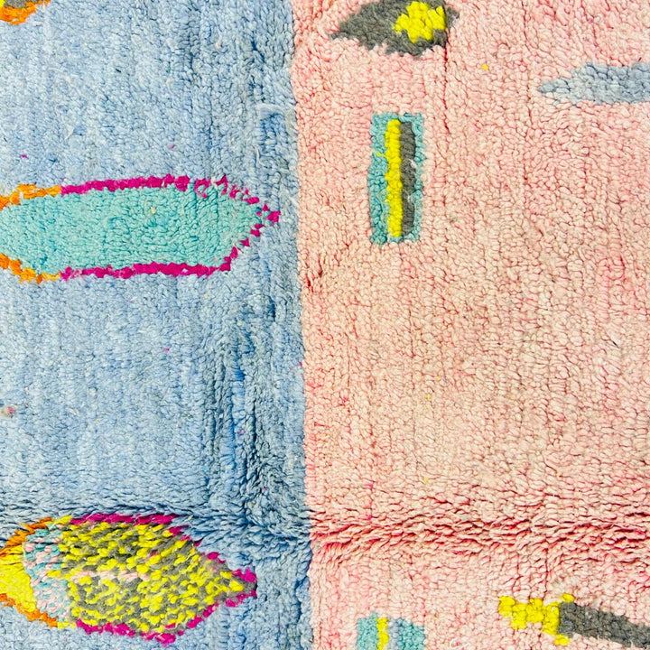 Vintage Moroccan wool rug with blush pink base and abstract Berber line patterns