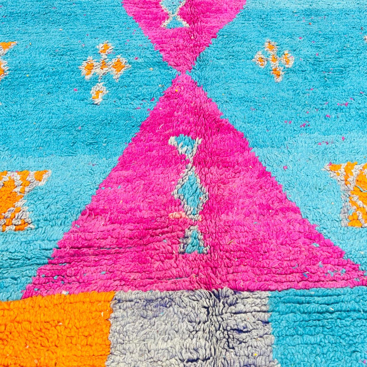 Vintage Moroccan rug with pink and teal geometric Berber design handmade from natural wool