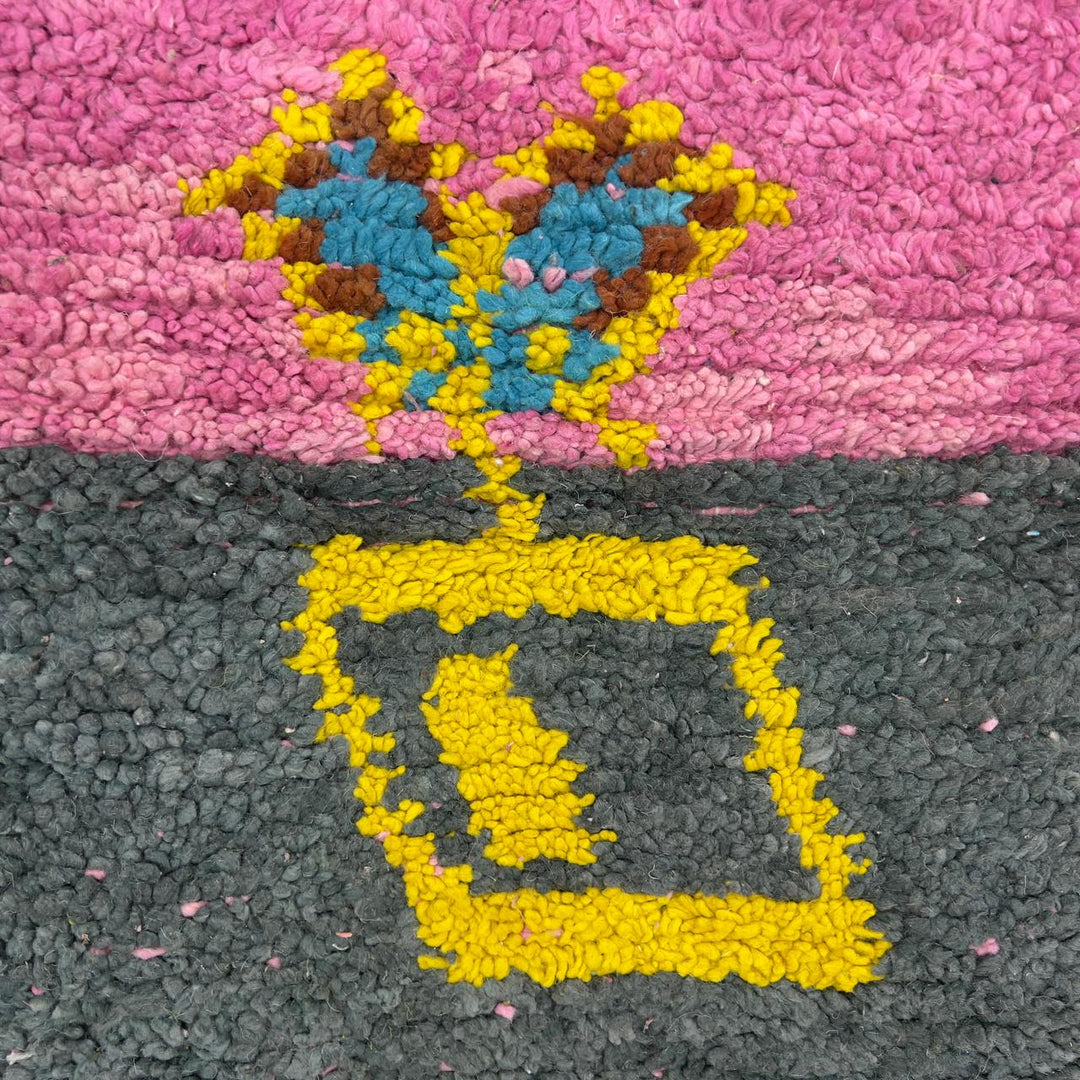 Vintage Moroccan wool rug with pink background and colorful striped central motif, handmade Berber rug 7.97 x 5.87 ft