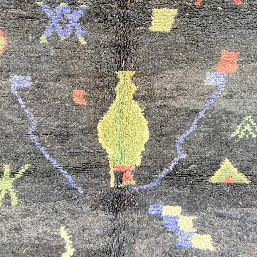 Black vintage Moroccan Berber rug with colorful tribal symbols handwoven in natural wool