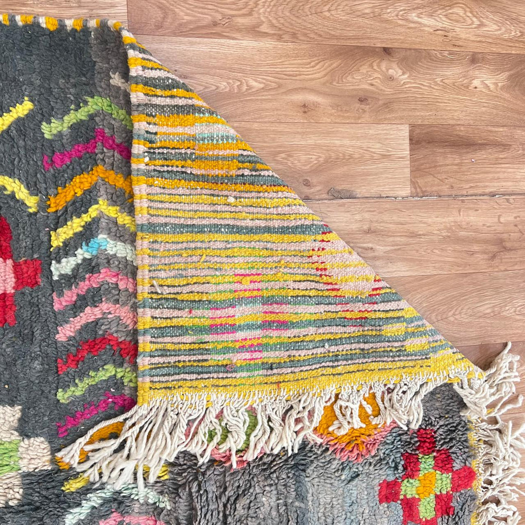 Vintage Moroccan wool rug with colorful Berber geometric pattern on gray background, handmade in Morocco, size 228 x 155 cm.