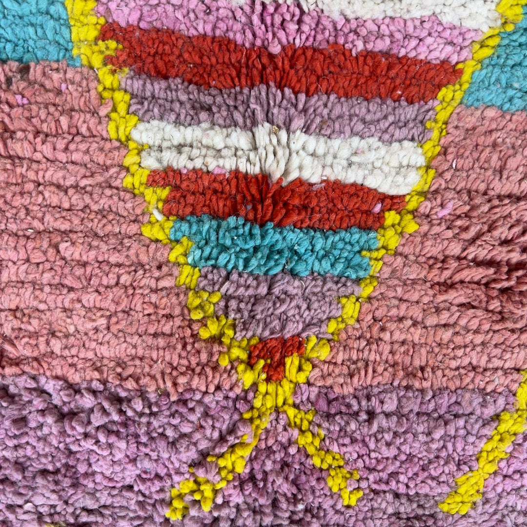 Vintage Moroccan wool rug with pink background and colorful striped central motif, handmade Berber rug 7.97 x 5.87 ft