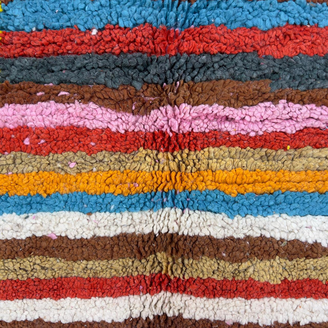 Vintage Moroccan wool rug with pink background and colorful striped central motif, handmade Berber rug 7.97 x 5.87 ft