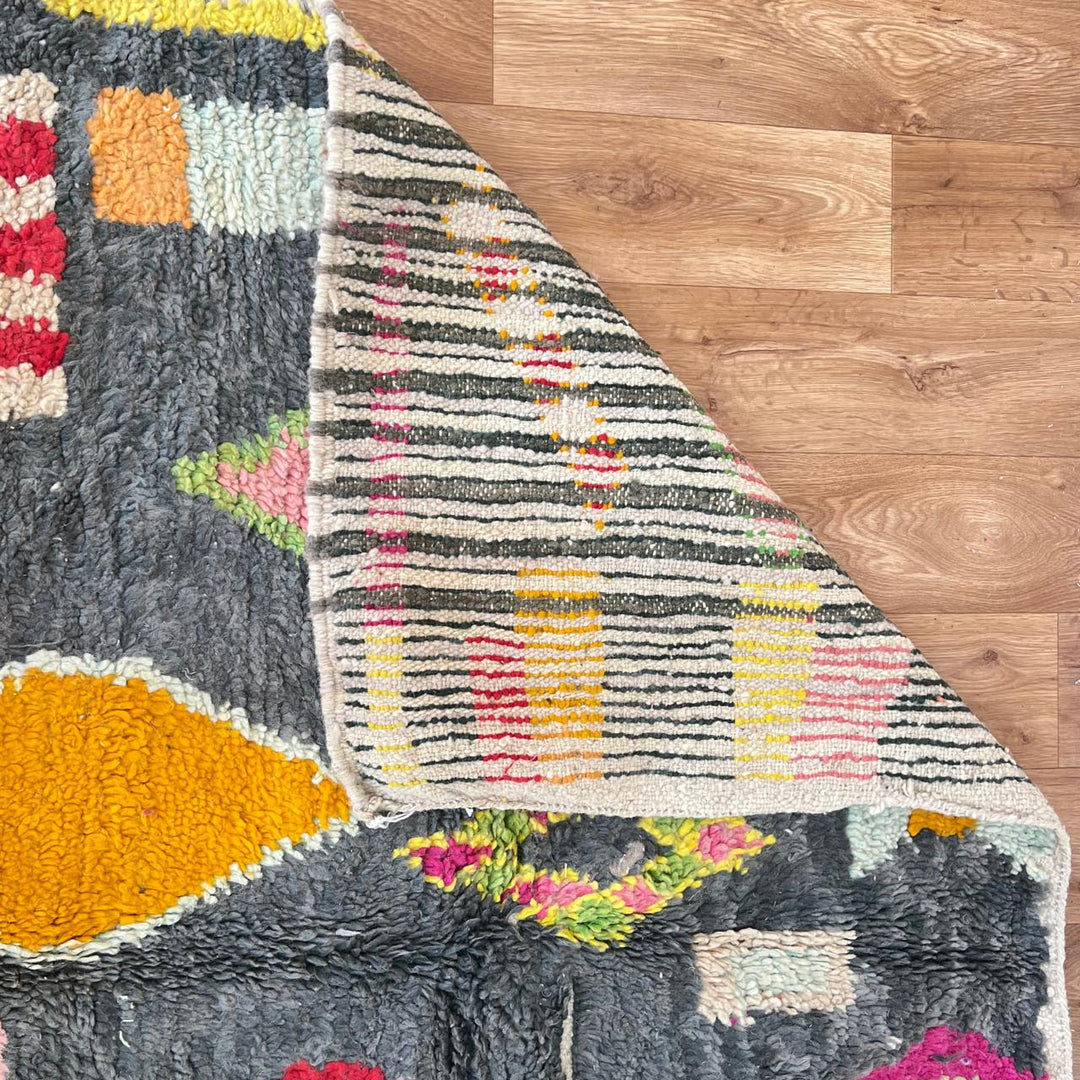 Vintage Moroccan wool rug with colorful Berber geometric pattern on gray background, handmade in Morocco, size 228 x 155 cm.