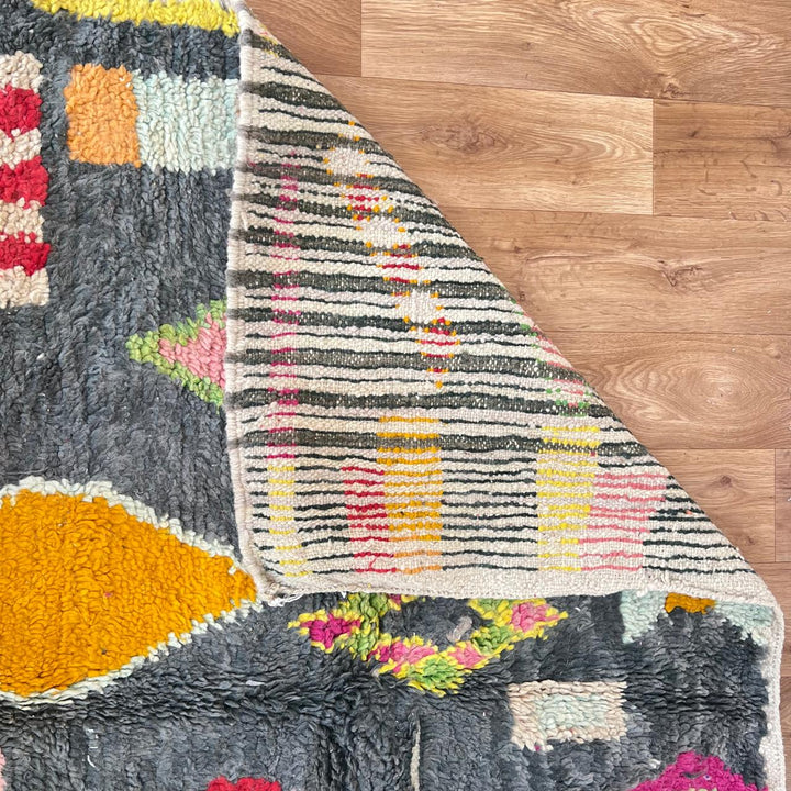 Vintage Moroccan wool rug with colorful Berber geometric pattern on gray background, handmade in Morocco, size 228 x 155 cm.