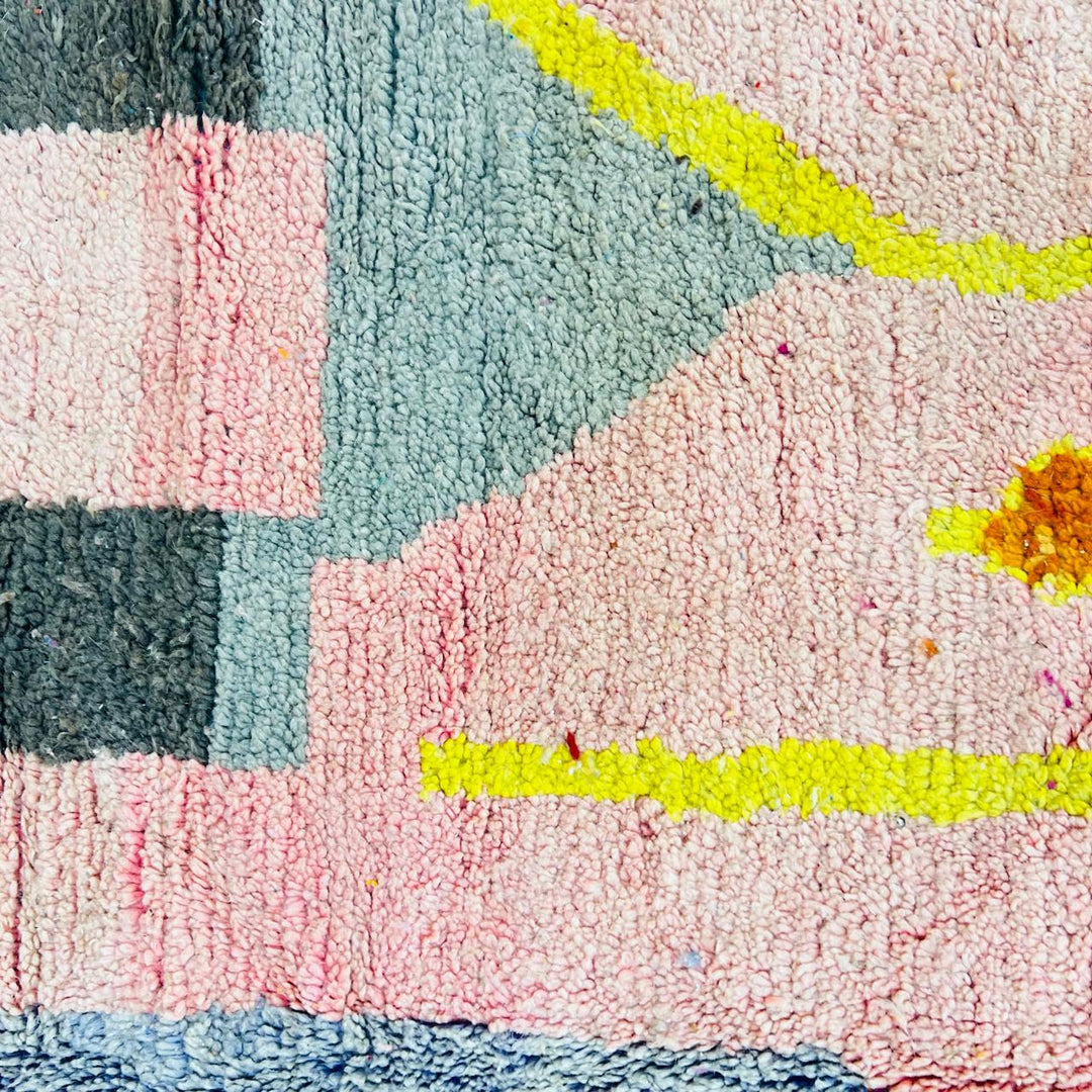 Vintage Moroccan wool rug with blush pink base and abstract Berber line patterns