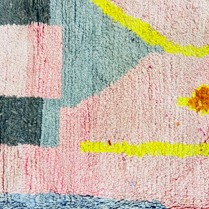 Vintage Moroccan wool rug with blush pink base and abstract Berber line patterns