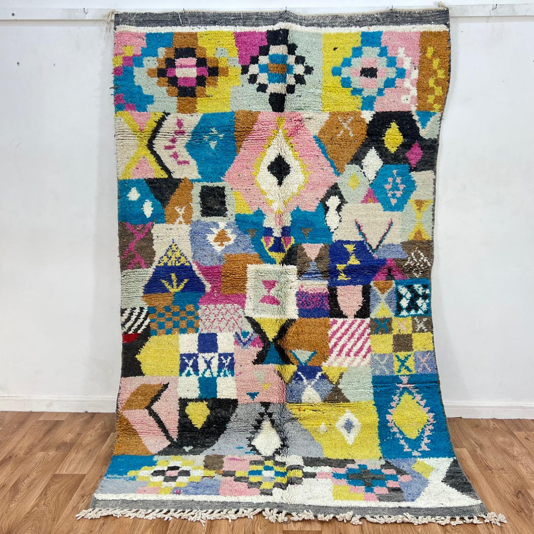 Vintage Moroccan wool rug with colorful patchwork geometric patterns in blue, pink, yellow and ivory, handwoven Berber rug 248x156 cm