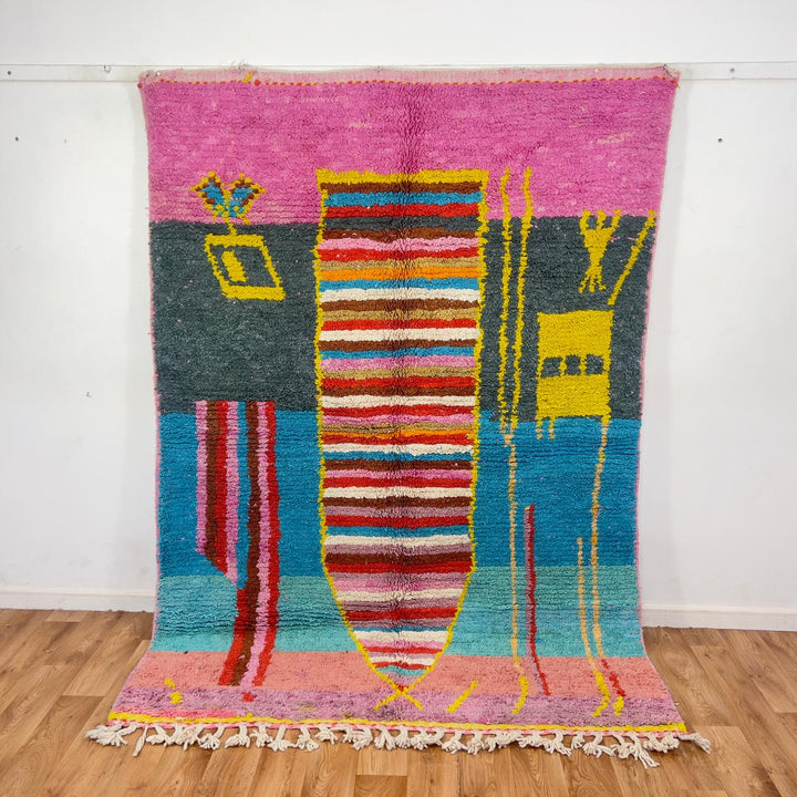 Vintage Moroccan wool rug with pink background and colorful striped central motif, handmade Berber rug 7.97 x 5.87 ft