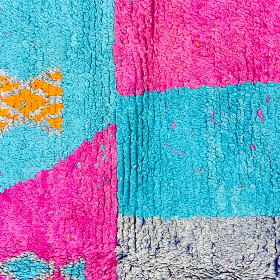 Vintage Moroccan rug with pink and teal geometric Berber design handmade from natural wool