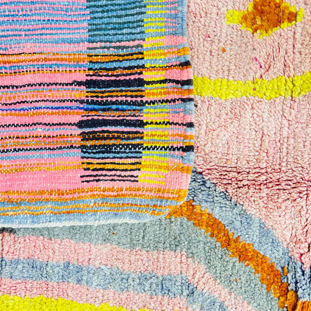Vintage Moroccan wool rug with blush pink base and abstract Berber line patterns