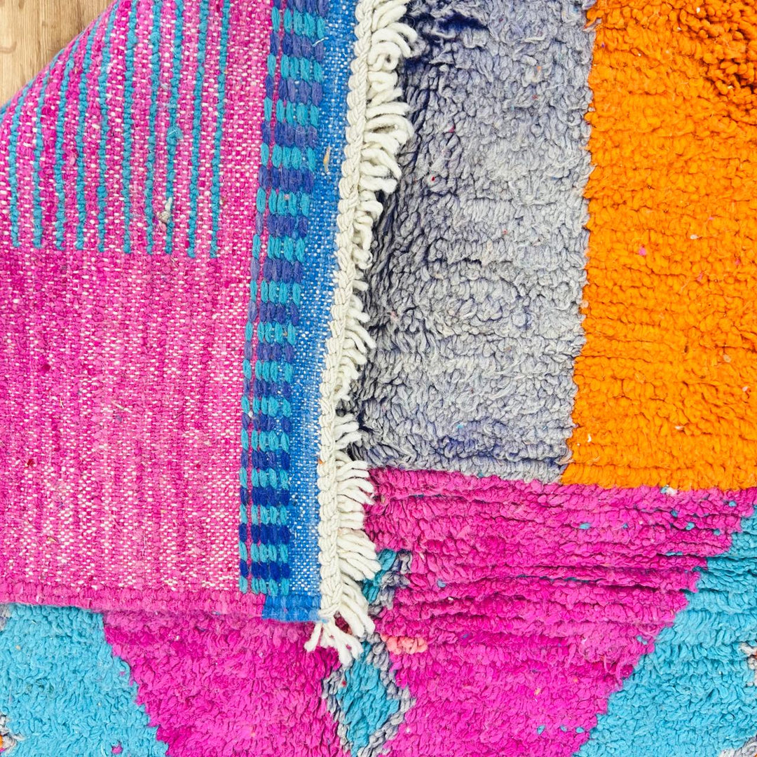 Vintage Moroccan rug with pink and teal geometric Berber design handmade from natural wool
