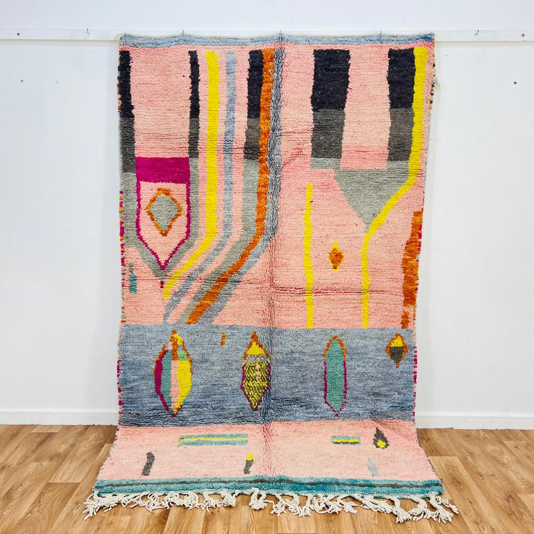 Vintage Moroccan wool rug with blush pink base and abstract Berber line patterns