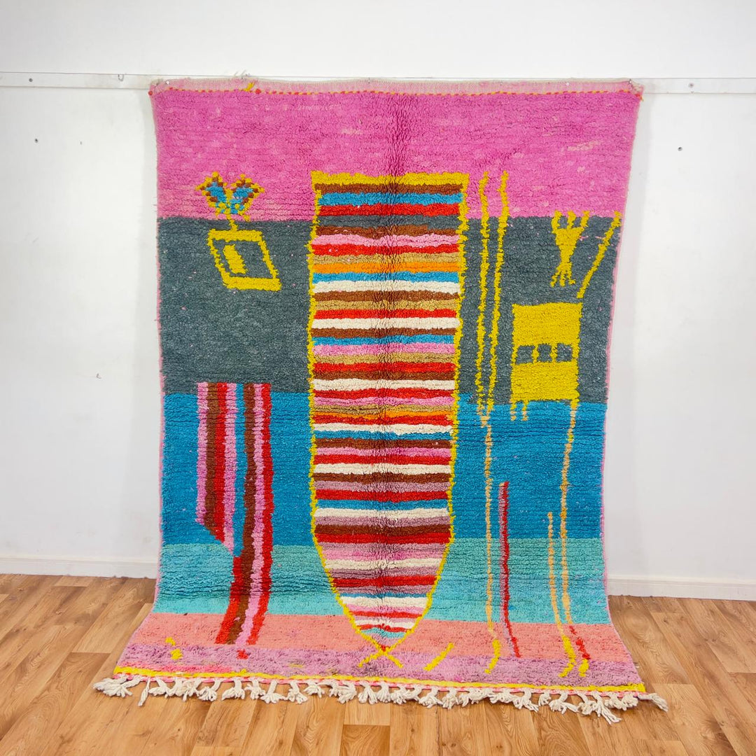 Vintage Moroccan wool rug with pink background and colorful striped central motif, handmade Berber rug 7.97 x 5.87 ft