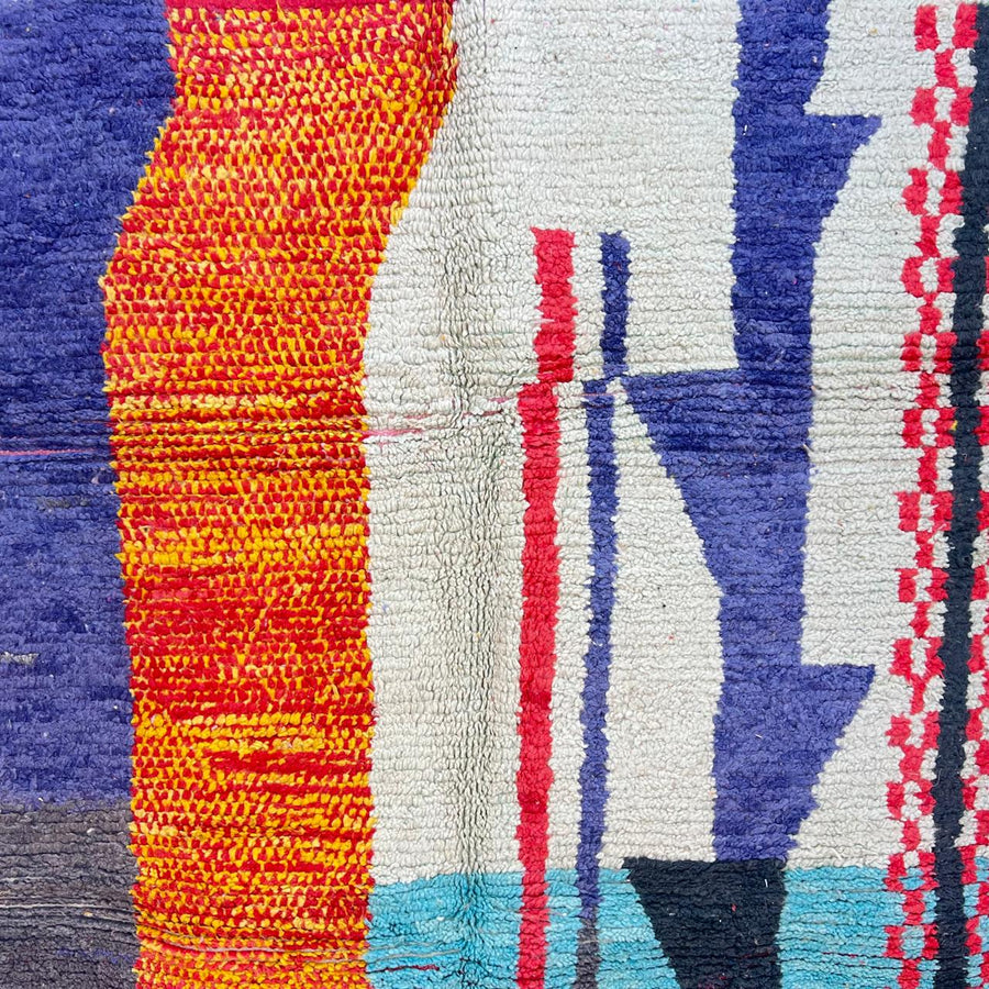 Vintage Moroccan wool rug with abstract color block design in mustard yellow, teal blue, pink, terracotta and ivory, handwoven by Berber artisans in Morocco.