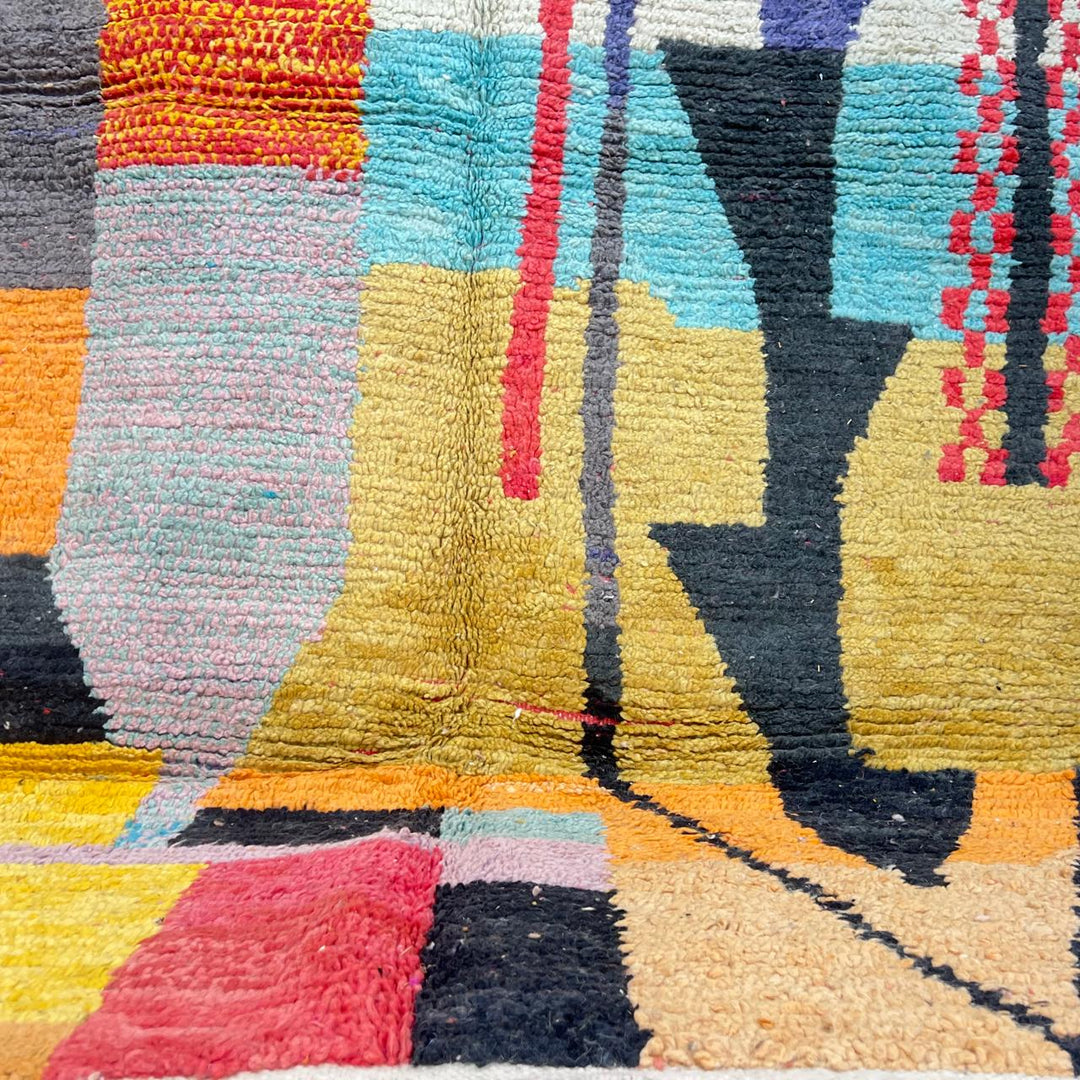 Vintage Moroccan wool rug with abstract color block design in mustard yellow, teal blue, pink, terracotta and ivory, handwoven by Berber artisans in Morocco.