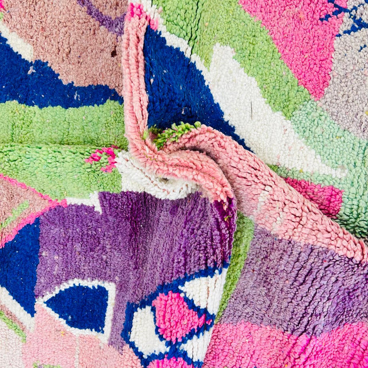 Vintage Moroccan wool rug 518 with pink base and colorful Berber geometric symbols, handmade in Morocco