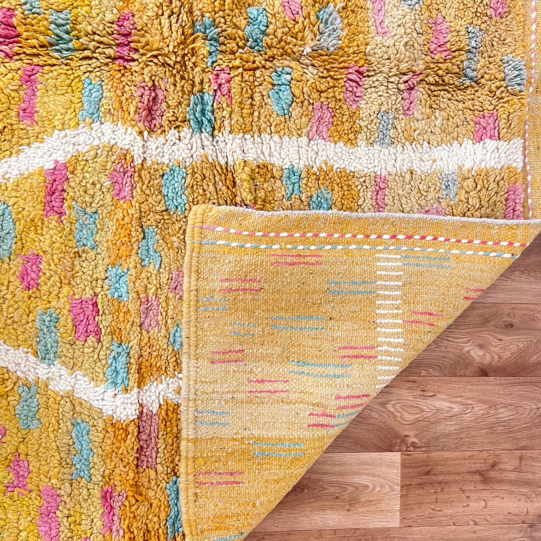 Vintage Moroccan wool rug in orange tones with white Berber diamond patterns, handmade in Morocco