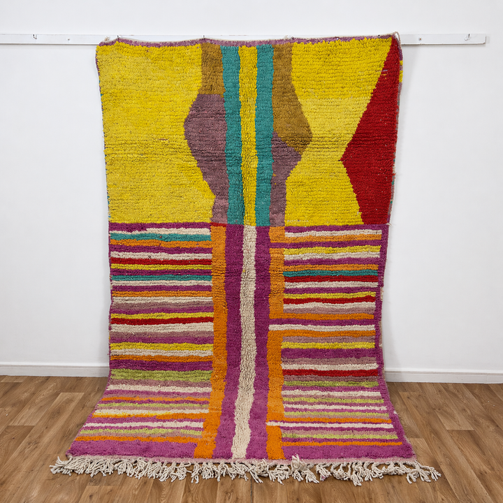 Vintage Moroccan wool rug 8.53x5.84 ft, handmade Berber shag rug with colorful striped pattern and central geometric design in yellow, pink, turquoise and red tones