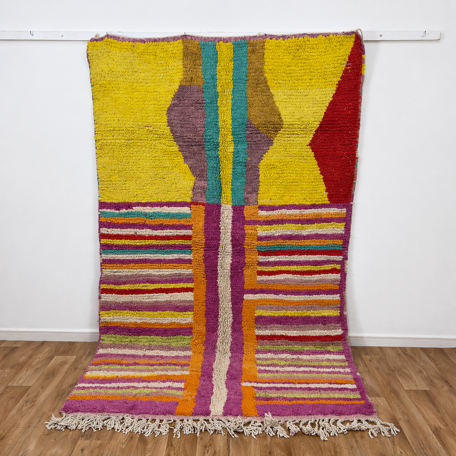Vintage Moroccan wool rug 8.53x5.84 ft, handmade Berber shag rug with colorful striped pattern and central geometric design in yellow, pink, turquoise and red tones