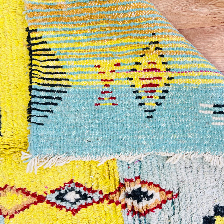 Vintage Moroccan wool rug with colorful Berber geometric symbols, handmade in Morocco