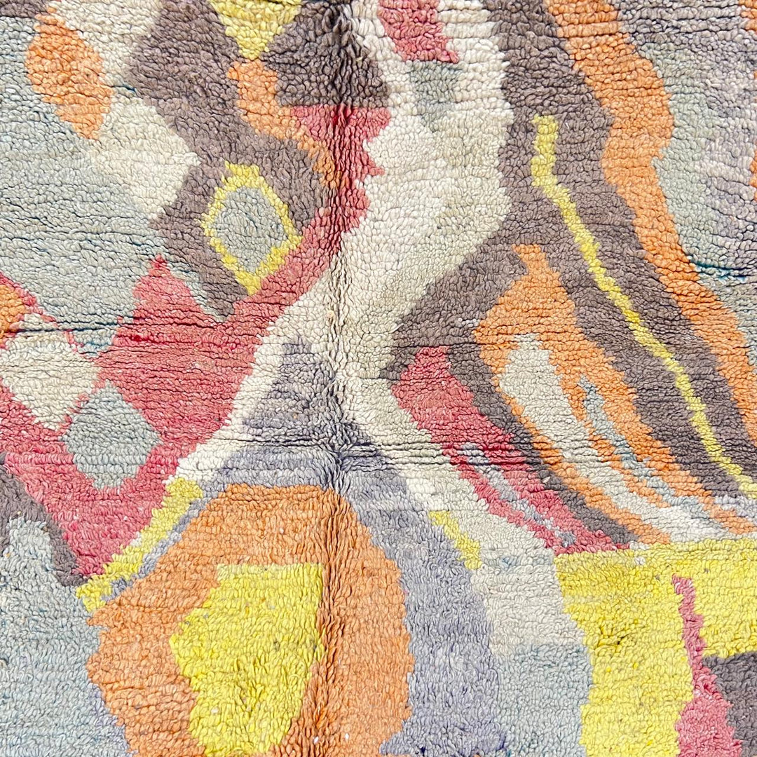 Vintage Moroccan wool rug with abstract Berber pattern in earthy tones, handmade in Morocco