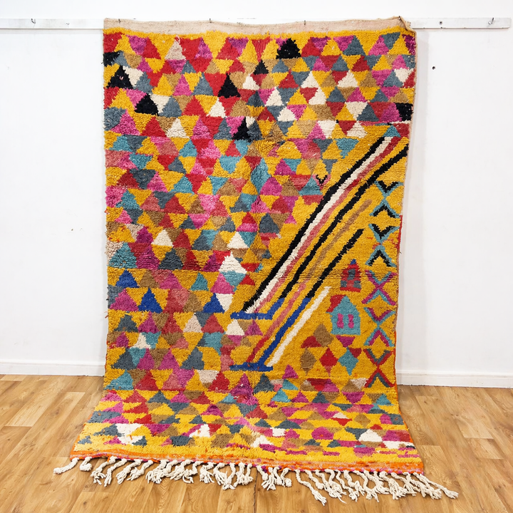 Vintage Moroccan wool rug 8.53x5.25 ft, handmade Berber rug with colorful triangle pattern and bold diagonal stripe design on yellow background