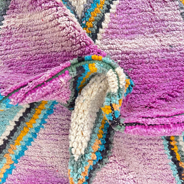 Vintage Moroccan wool rug with purple background and colorful diamond Berber patterns, handmade in Morocco