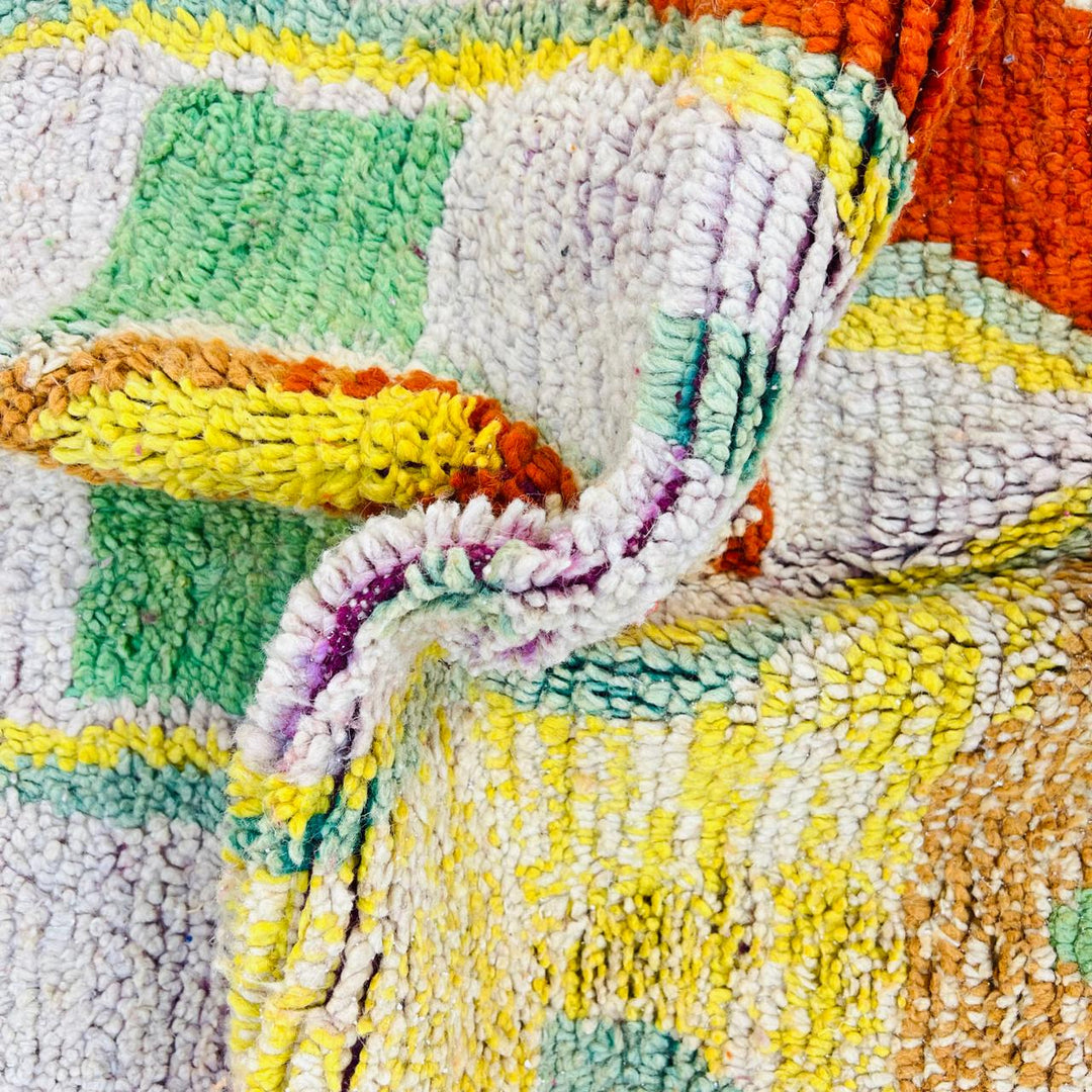 Vintage Moroccan wool rug with colorful Berber geometric symbols, handmade in Morocco