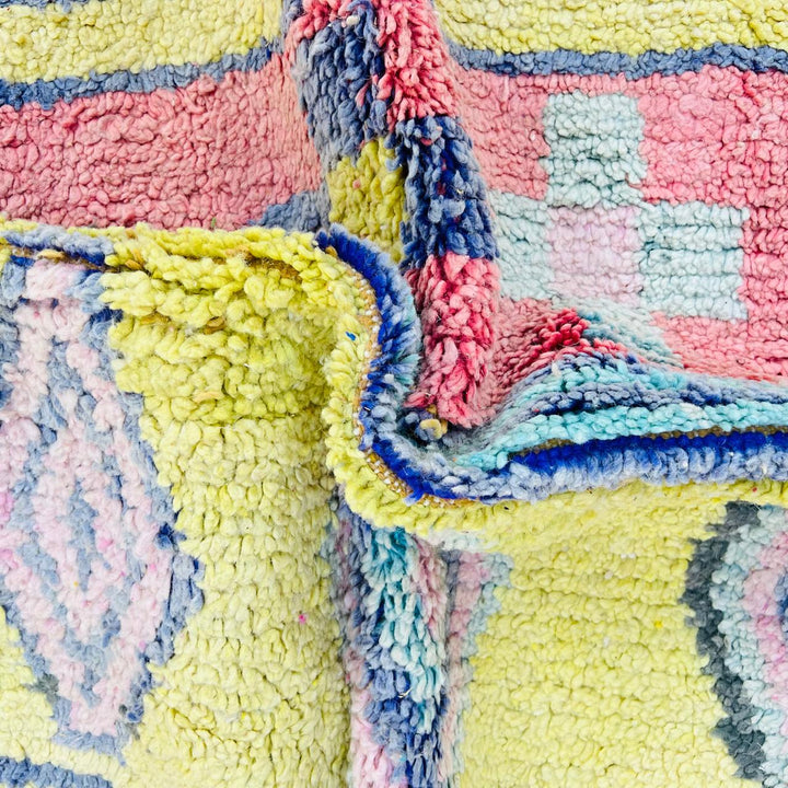 Vintage Moroccan wool rug with colorful Berber geometric patterns, handmade in Morocco