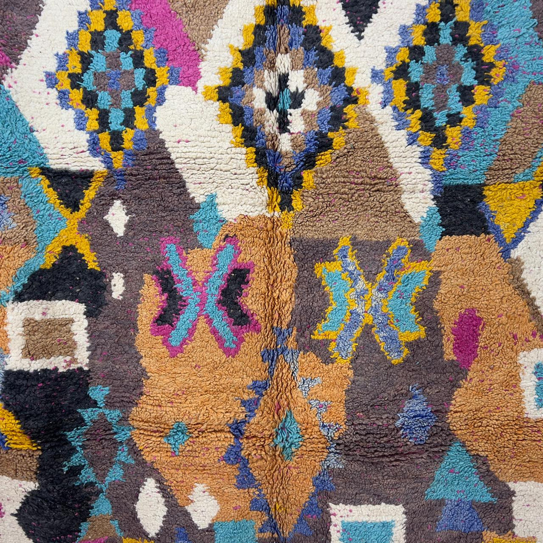 Vintage Moroccan wool rug 8.53x5.68 ft, handmade Berber shag carpet with colorful geometric tribal patterns in brown, pink, blue and mustard tones