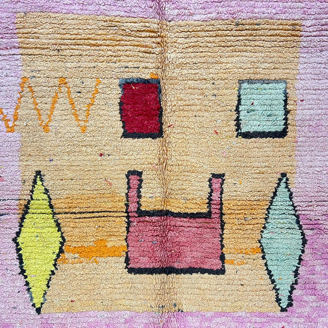 Vintage Moroccan wool rug with pink tones and abstract Berber symbols, handmade in Morocco