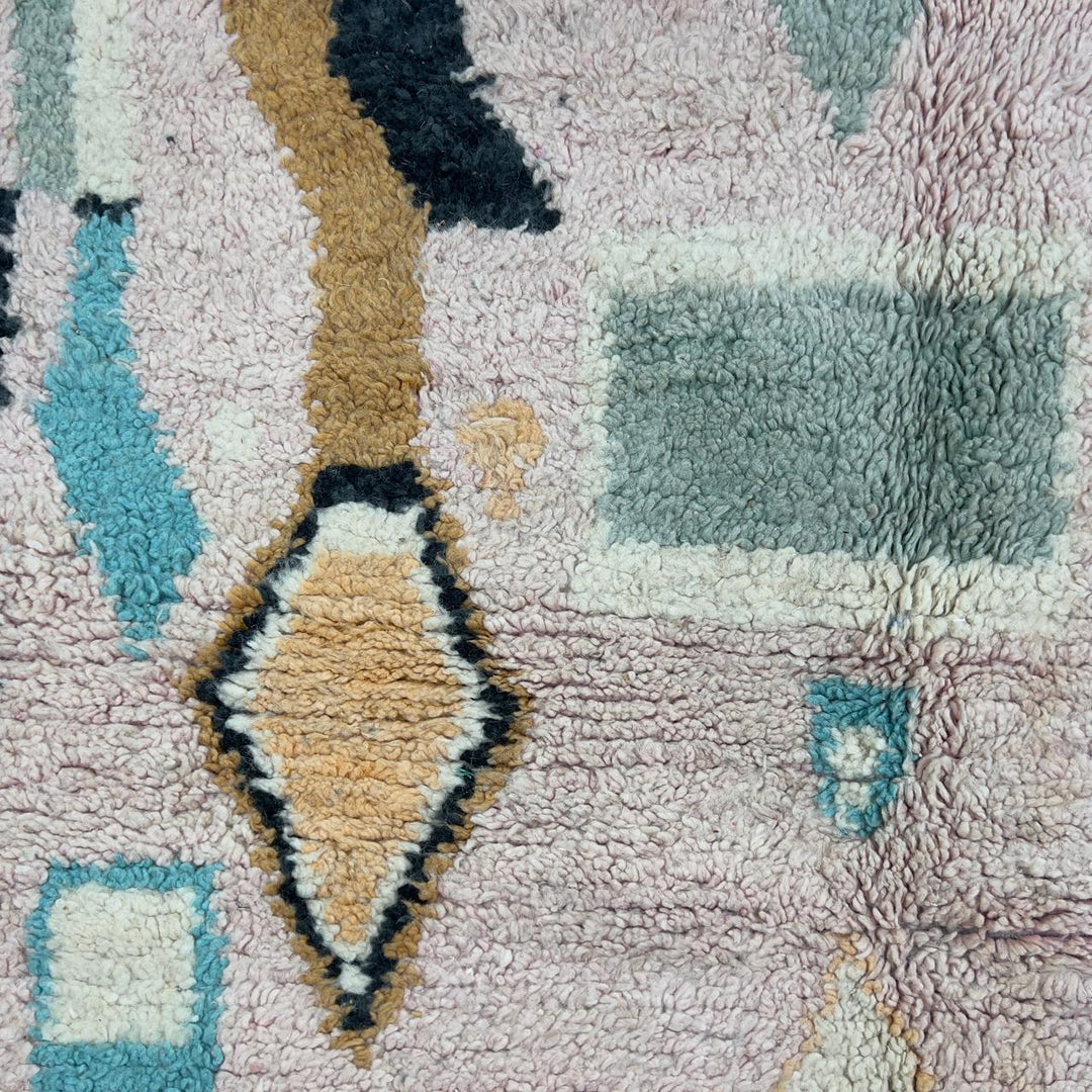 Vintage Moroccan wool rug with abstract geometric patterns in beige, mustard, and turquoise tones, handmade Berber carpet