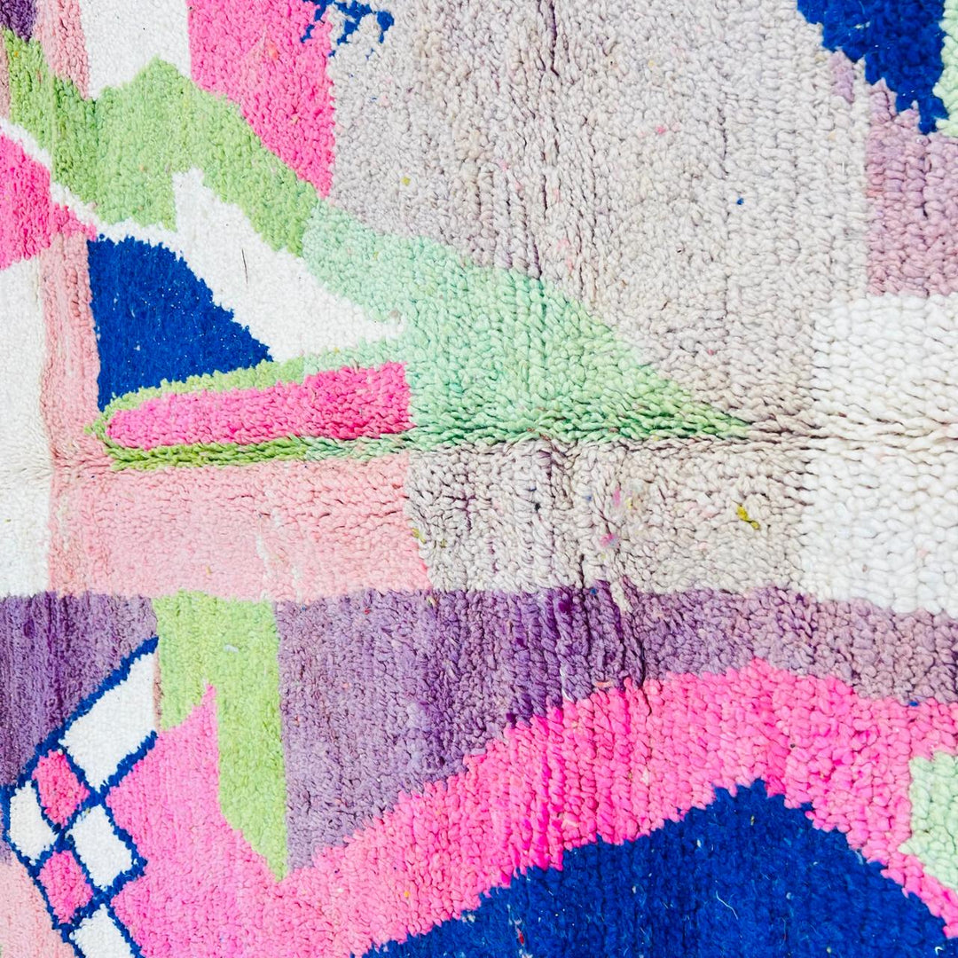 Vintage Moroccan wool rug 518 with pink base and colorful Berber geometric symbols, handmade in Morocco